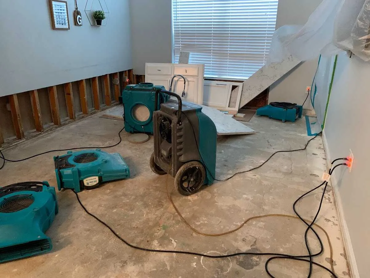 Dehumidifier in flood-cut room for Water Damage Restoration in Clay